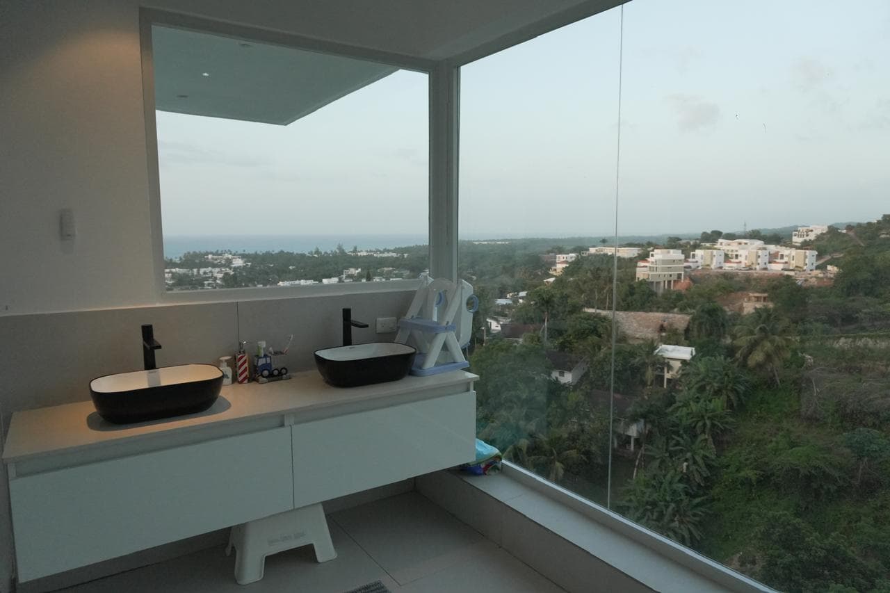 Black designer bathroom with ocean view
