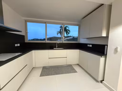 Kitchen with floating staircase